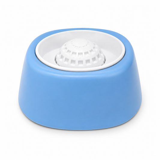 Blue slow feeder dog bowl with white rolling ball on a white background.