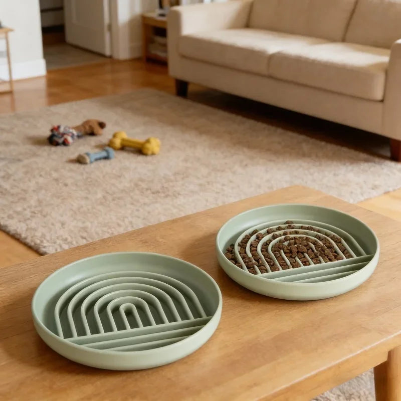 Non-slip slow feeder dog bowls on a table designed to help fast eaters slow down during meals.